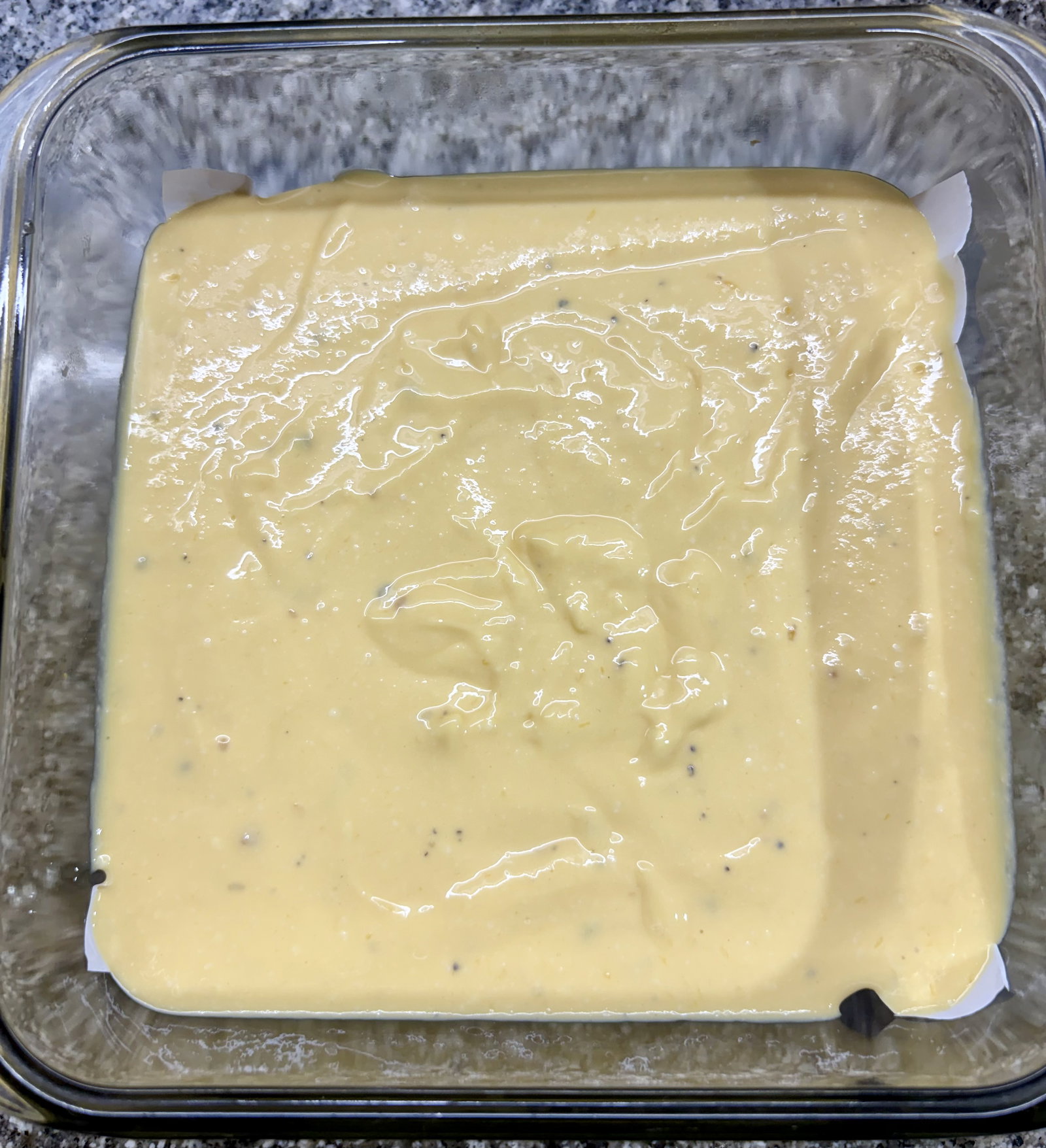 Step 2.1: Grease a heat-safe cake tin, steel or glass container with ghee or oil, or line it with parchment paper