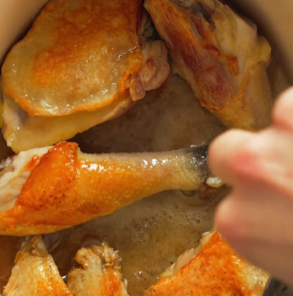 Step 2.1: Brown the chicken legs and wings in a cocotte until deeply caramelized