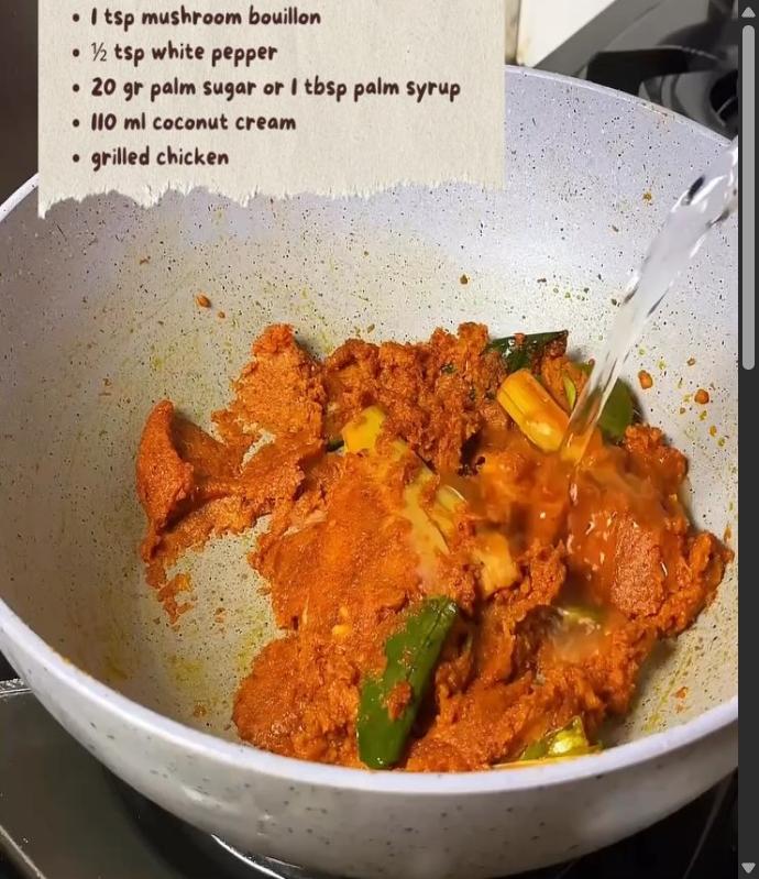 Step 7.1: Add water, tamarind water, salt, mushroom bouillon, white pepper, palm sugar, coconut cream, and the grilled chicken to the pan