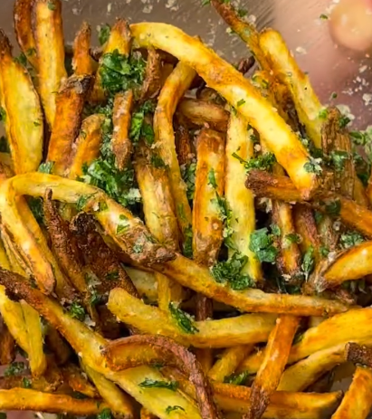 Step 1.1: Toss the hot fries with parmesan, truffle oil, and parsley
