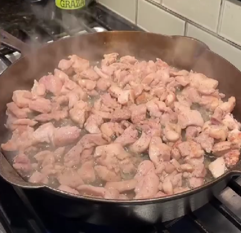 Step 2.1: Add chicken in a single layer and cook for 4–5 minutes until lightly golden