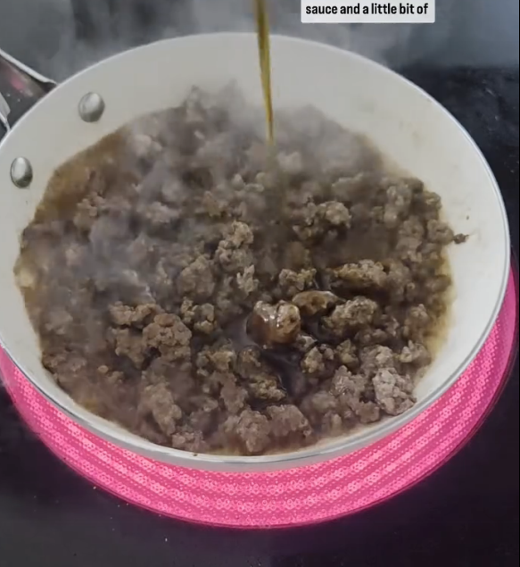 Step 1.1: Add soy sauce and pure maple syrup to the cooked beef, stirring to coat evenly