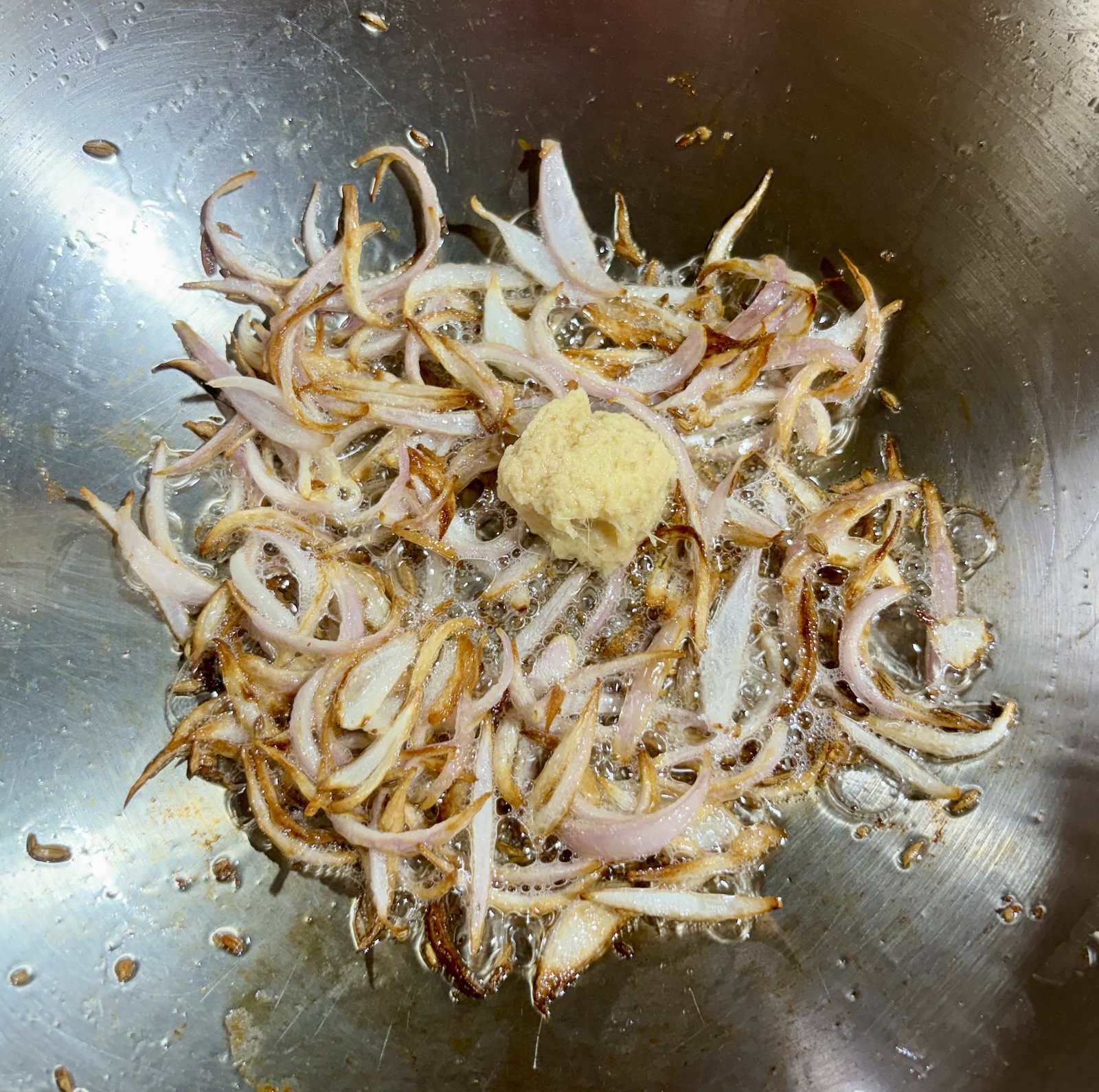 Step 2.1: Stir in the ginger-garlic paste and sauté for 30–40 seconds until the rawness disappears