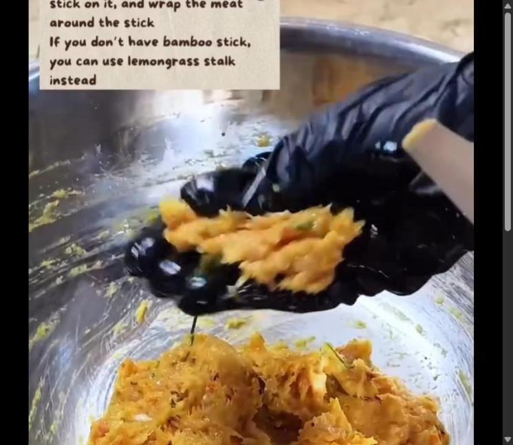 Step 3.1: Take the meat mixture, place a bamboo stick or lemongrass stalk on it, and wrap the meat around the stick