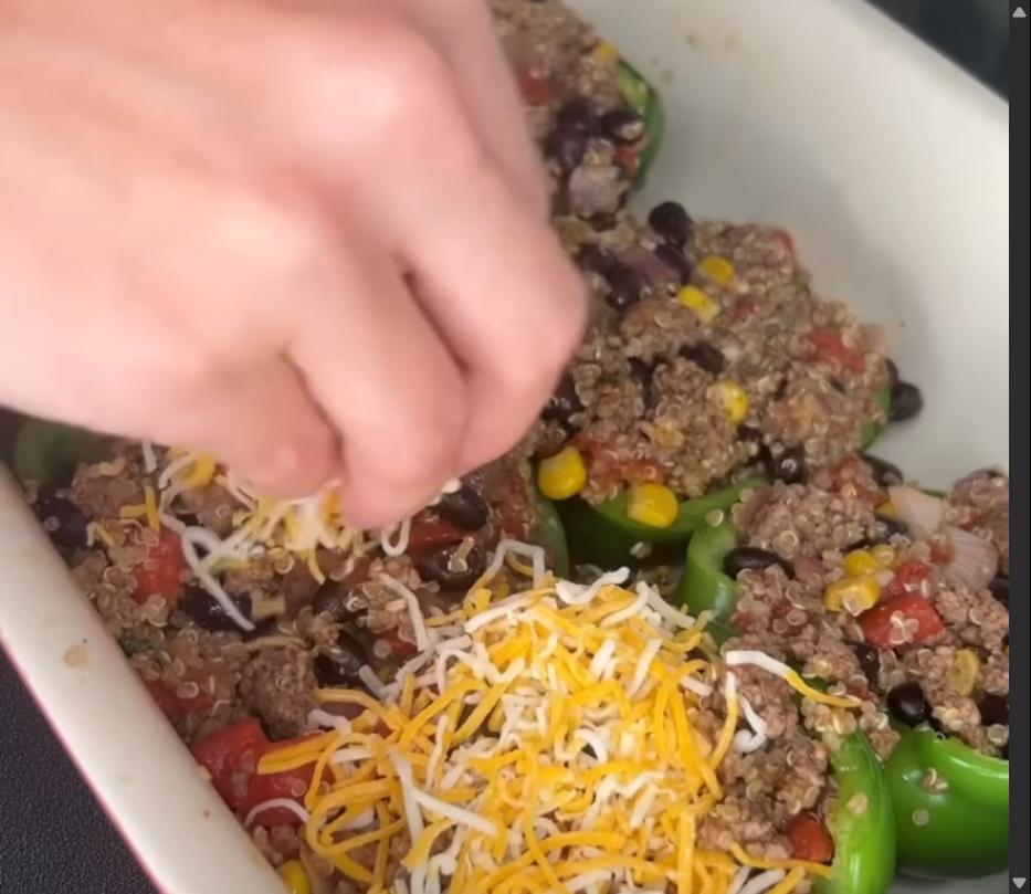 Step 4.1: Top each stuffed pepper with shredded cheese