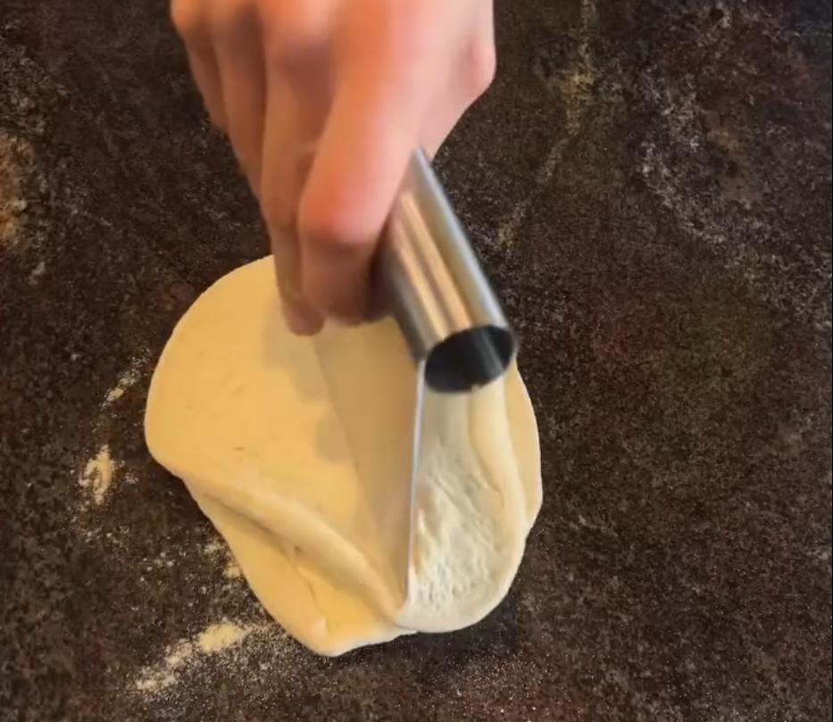 Step 1.1: Combine the two dough balls and remove some of the air by rolling them out