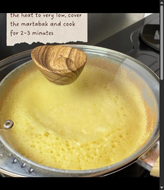 Step 2.1: When all the tiny holes have popped up, turn the heat to very low, cover the martabak and cook for 2-3 minutes