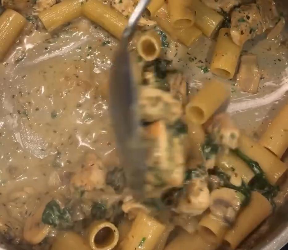 Step 1.1: Return the chicken and cooked pasta to the pan and stir to combine, loosening with pasta water if needed