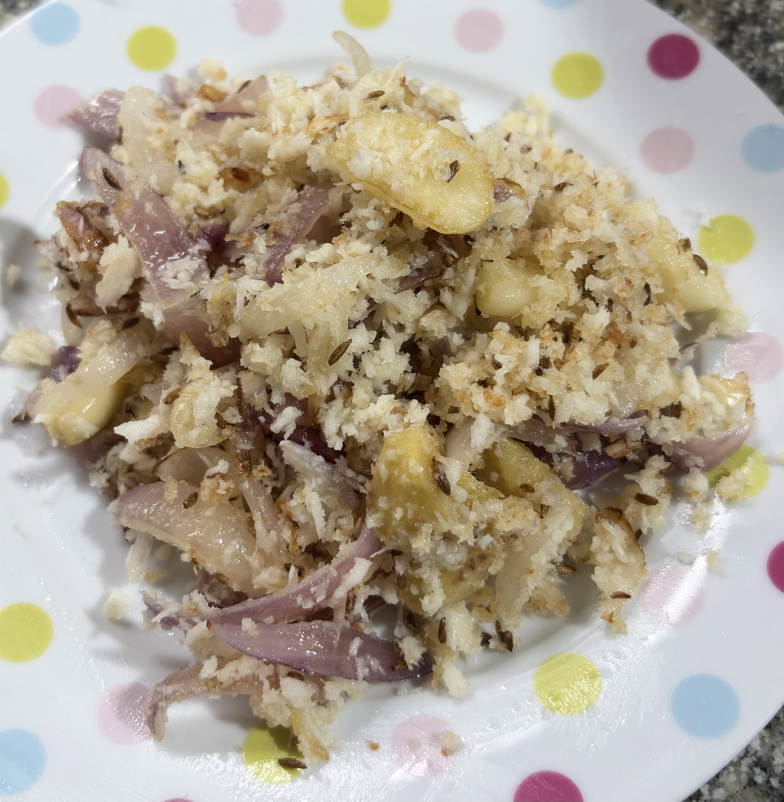 Step 2.2: Stir in the grated coconut and sauté until it turns a light golden-brown