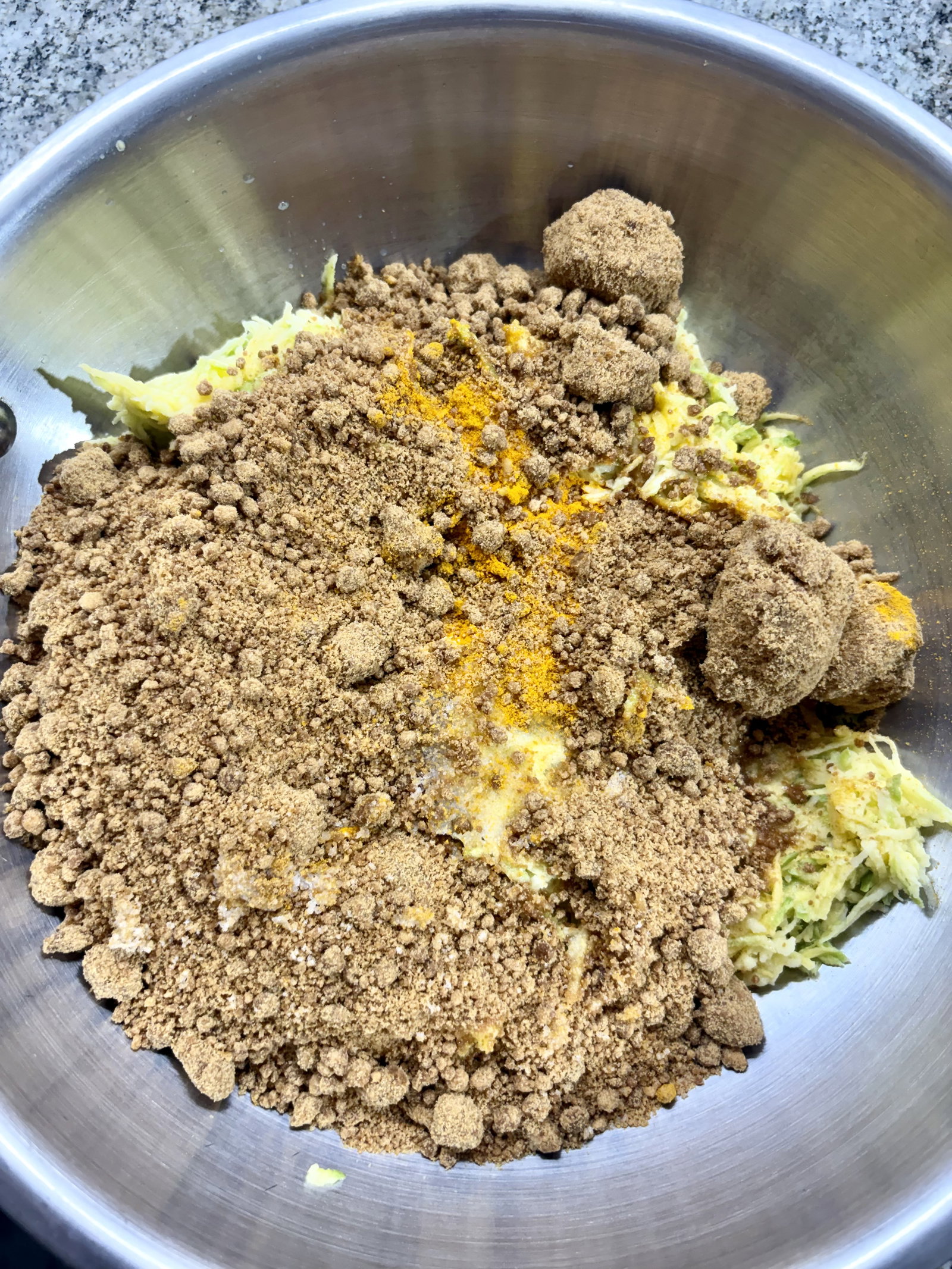 Step 2.1: Transfer the grated mangoes directly into a heavy-bottomed pan or kadhai