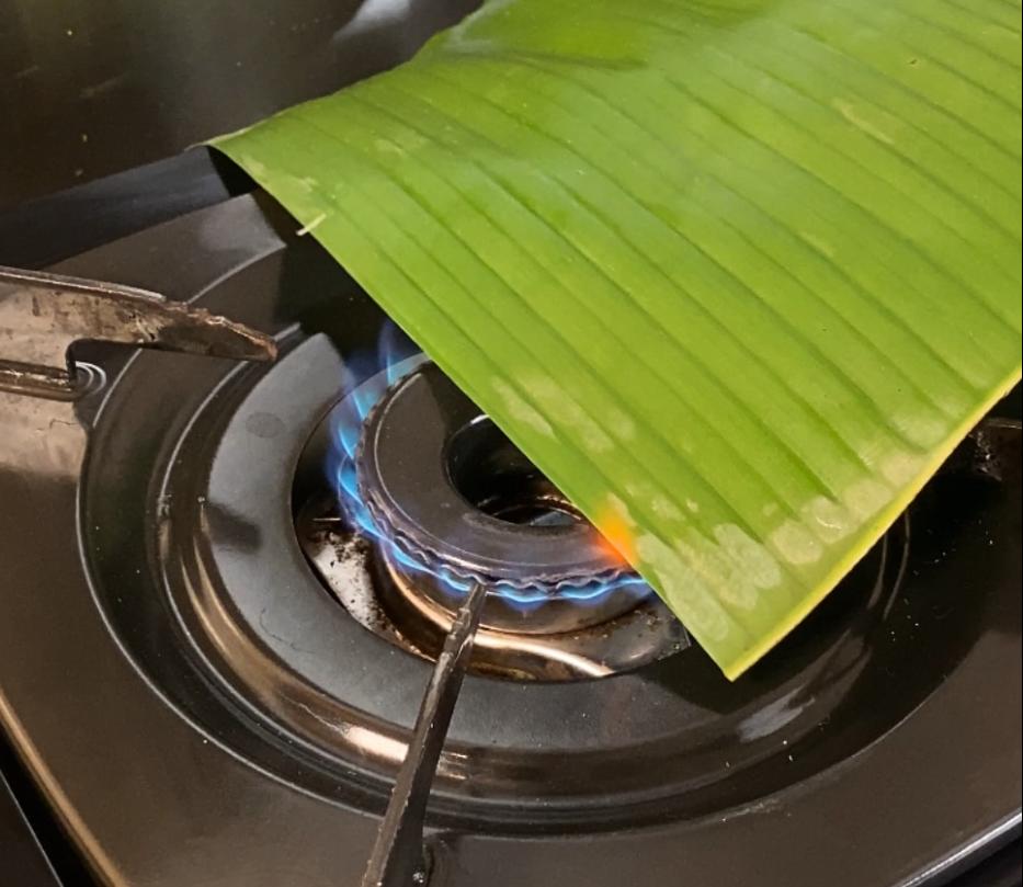 Step 1.1: Pre-heat the banana leaf over a flame to make it softer
