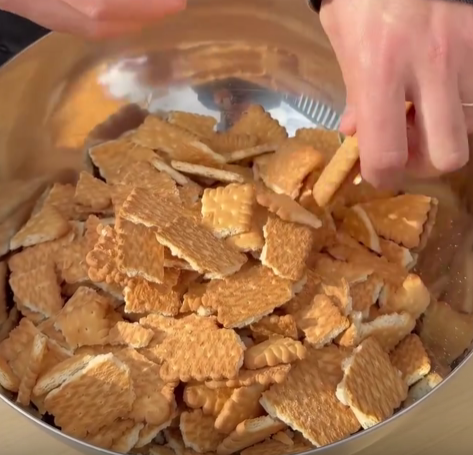 Step 1.1: Break tea biscuits into a large bowl without crushing them too much
