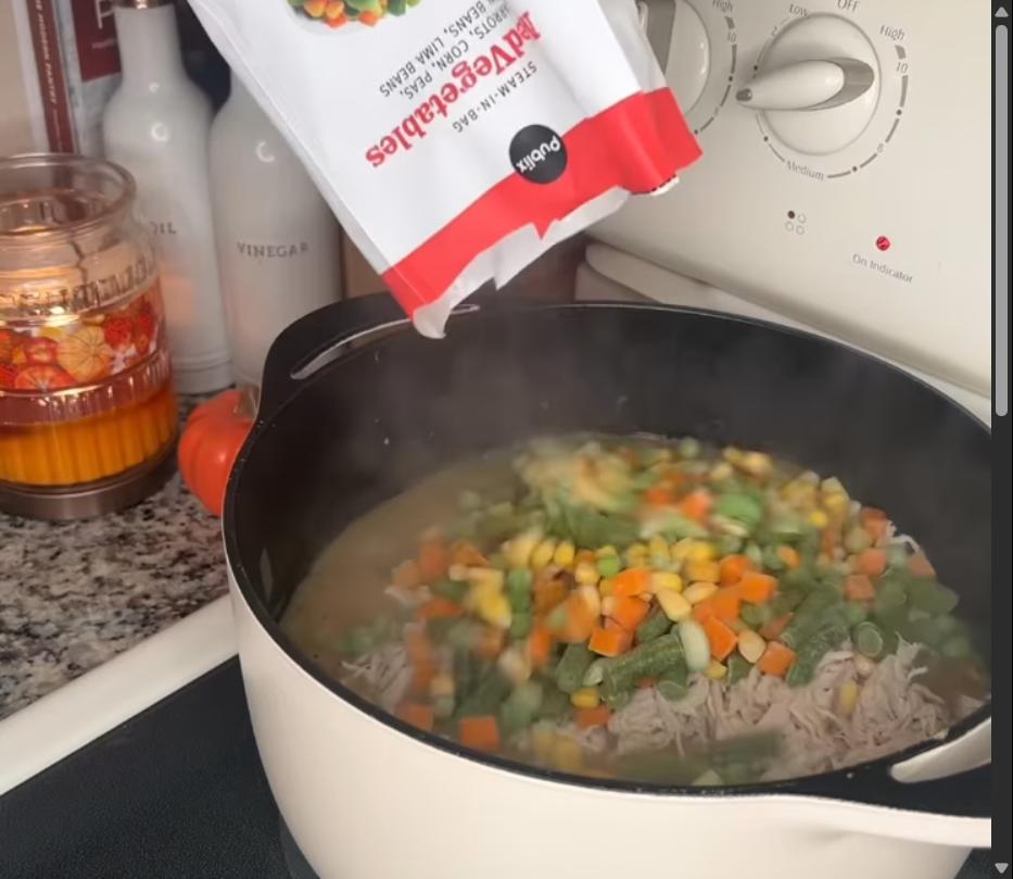 Step 1.1: Add shredded chicken back to the pot along with frozen mixed vegetables