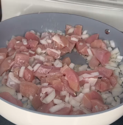 Step 1.1: Heat olive oil in a large sauté pan and cook chicken and onion until chicken is cooked through and onion is softened