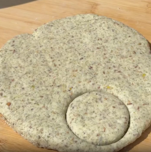Step 1.1: Transfer the dough to a floured surface, flatten it to about 2 cm thickness, and cut into circles
