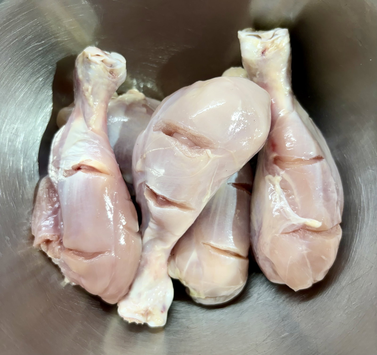 Step 1.1: Pat the chicken drumsticks dry with a paper towel and make deep slits across the thickest parts of the meat