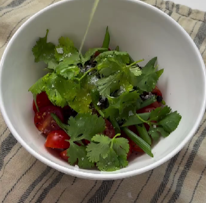 Step 2.1: Combine cherry tomatoes, sumac, scallions, parsley (or cilantro), olive oil, salt, and pepper in a bowl