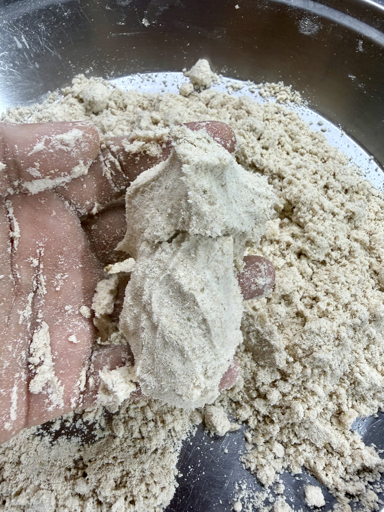 Step 2.1: Pour in ghee and rub it thoroughly into the flour using your fingertips until the mixture resembles coarse breadcrumbs and holds its shape when pressed