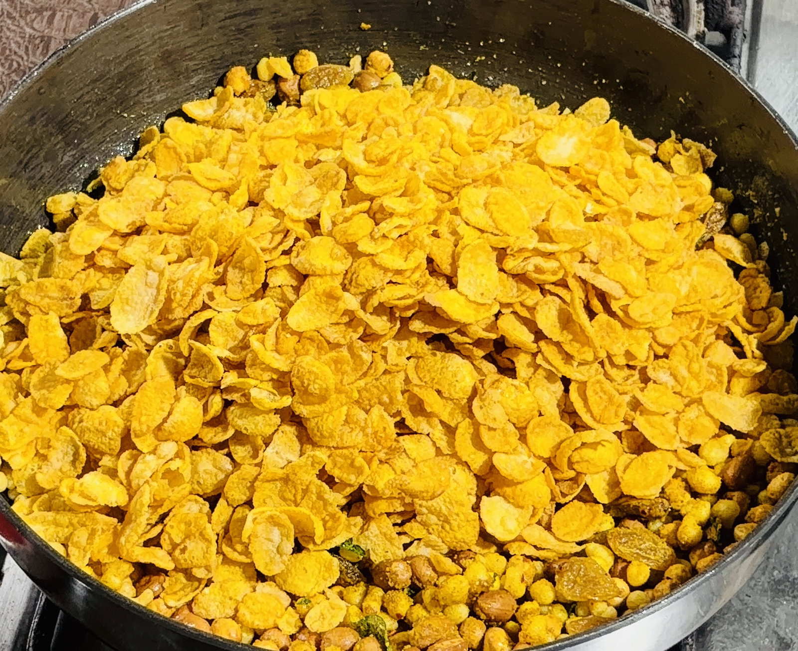 Step 3.1: Add the cornflakes and gently fold the mixture from the bottom up using a spatula