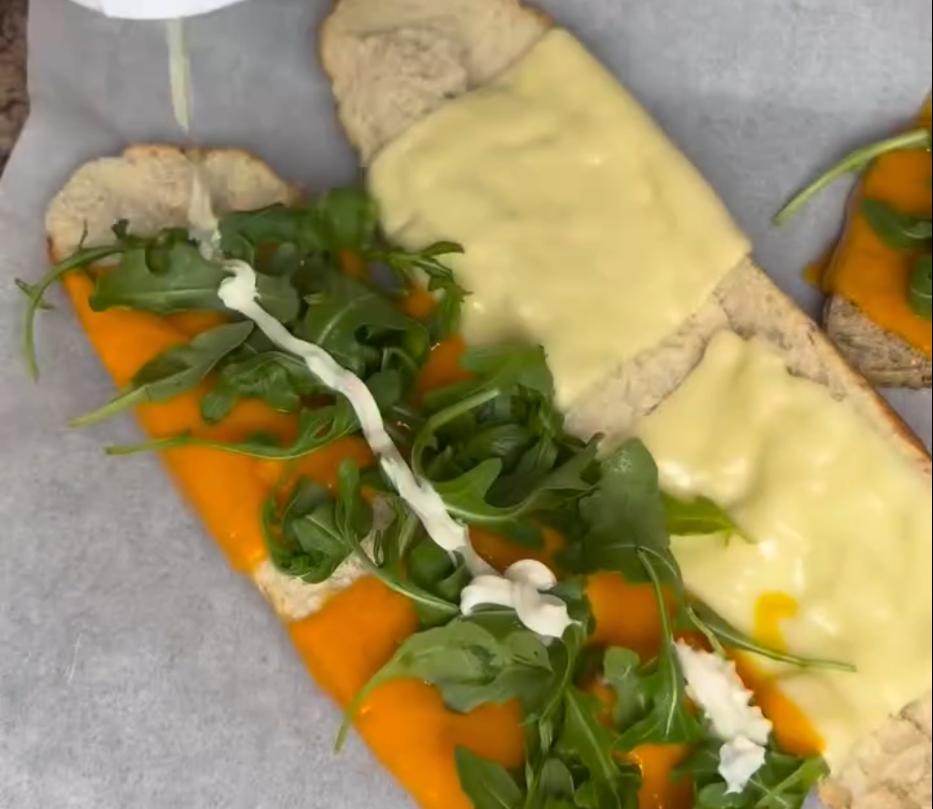Step 2.1: Layer the bread with mayonnaise, the cooked chicken, Red Leicester cheese, mozzarella cheese, and rocket