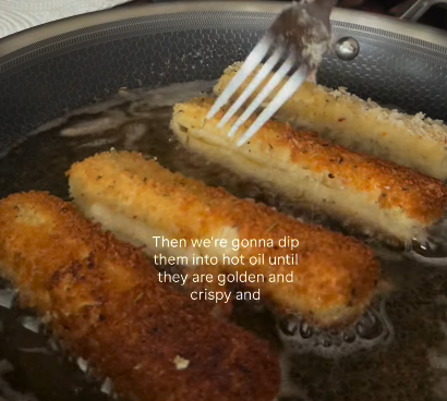 Step 1.1: Carefully set the sticks in the heated oil, ensuring they sit rather than being submerged