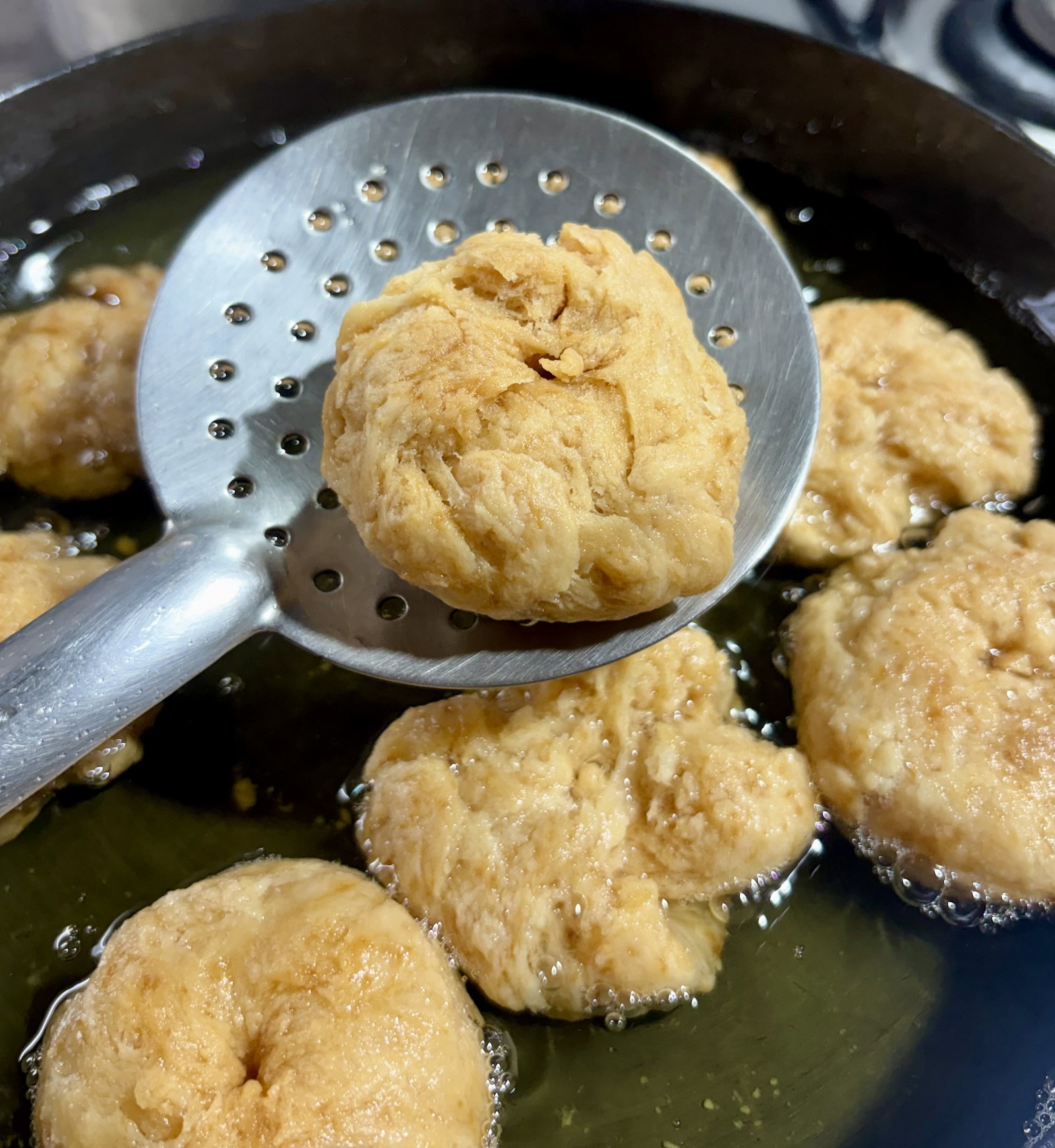 Step 2.1: Once golden brown, remove the balushahi with a slotted spoon and place them on a paper towel to absorb excess oil