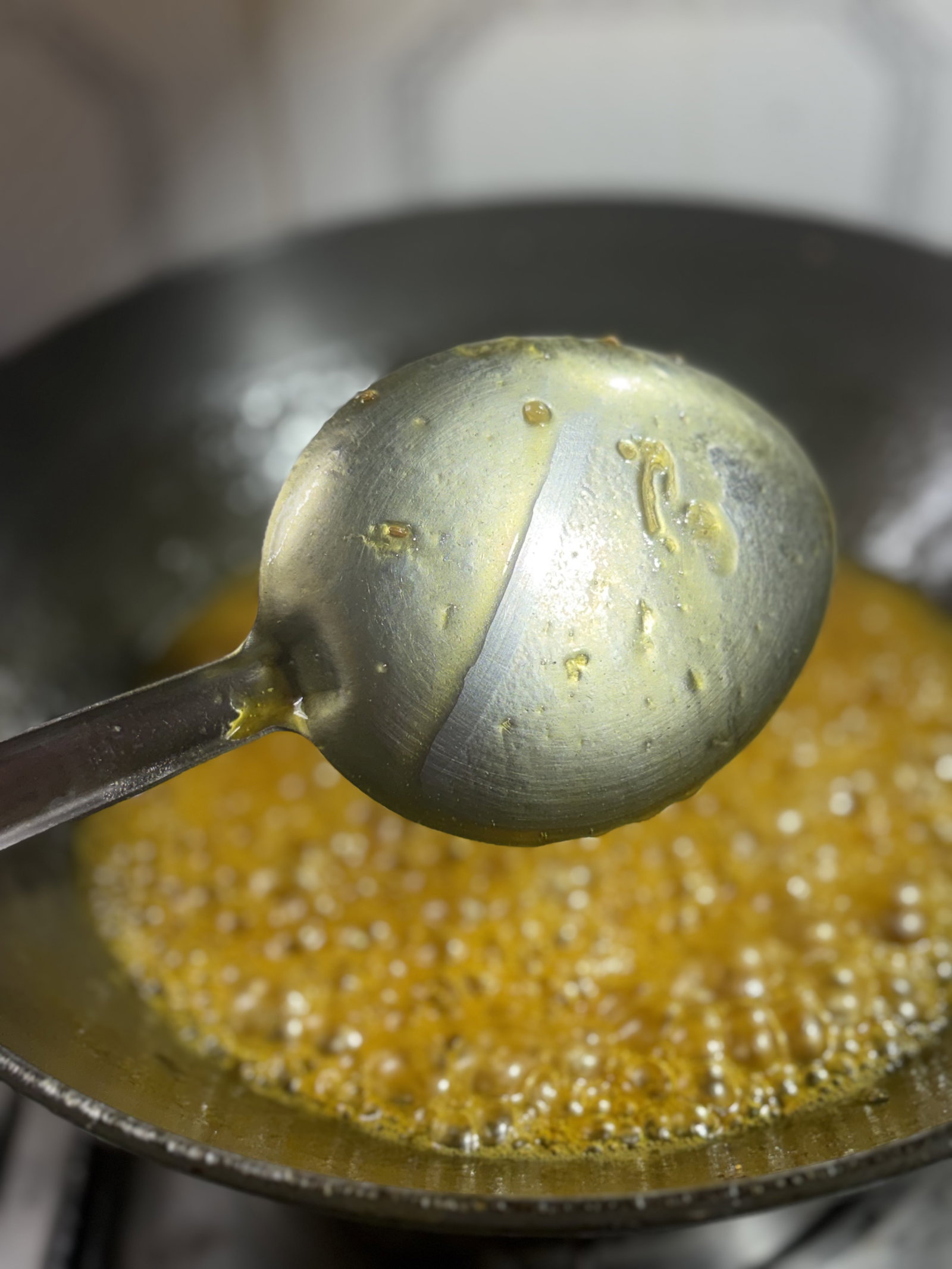 Step 2.1: Simmer the mixture, stirring occasionally, until it reduces to a semi-thick consistency that coats the back of the spoon