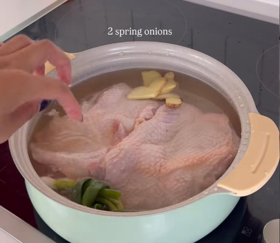 Step 1.1: Place the chicken in a pot with cold water, ginger slices, spring onion, and Shaoxing wine