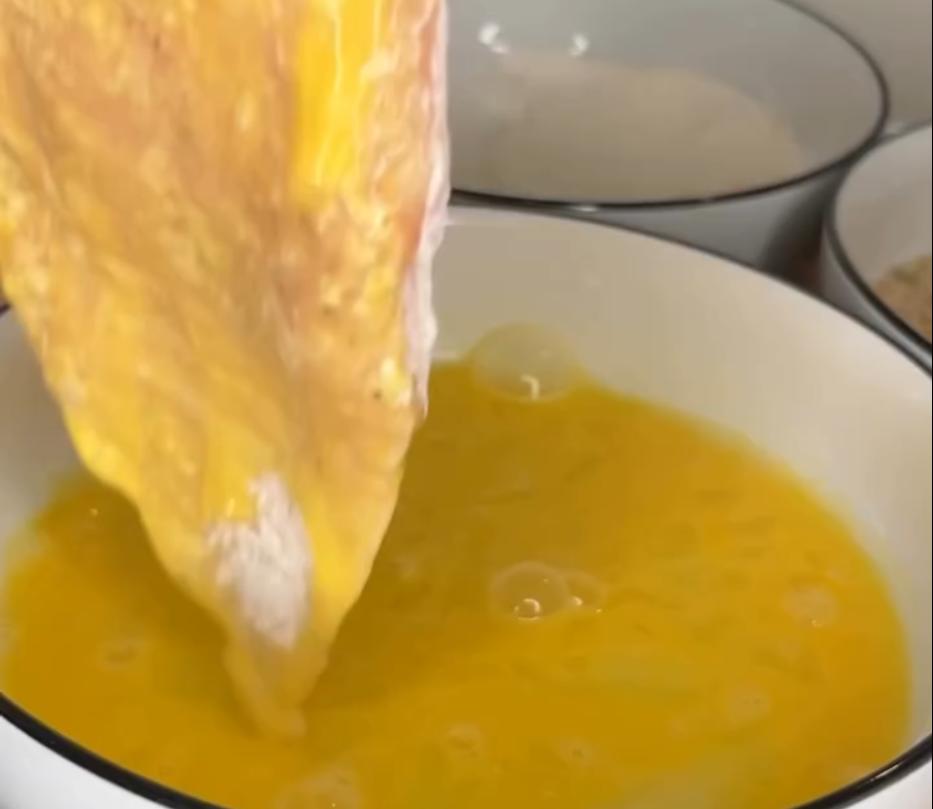 Step 2.1: Dredge chicken in flour, then dip in egg wash, and coat with Italian seasoned bread crumbs