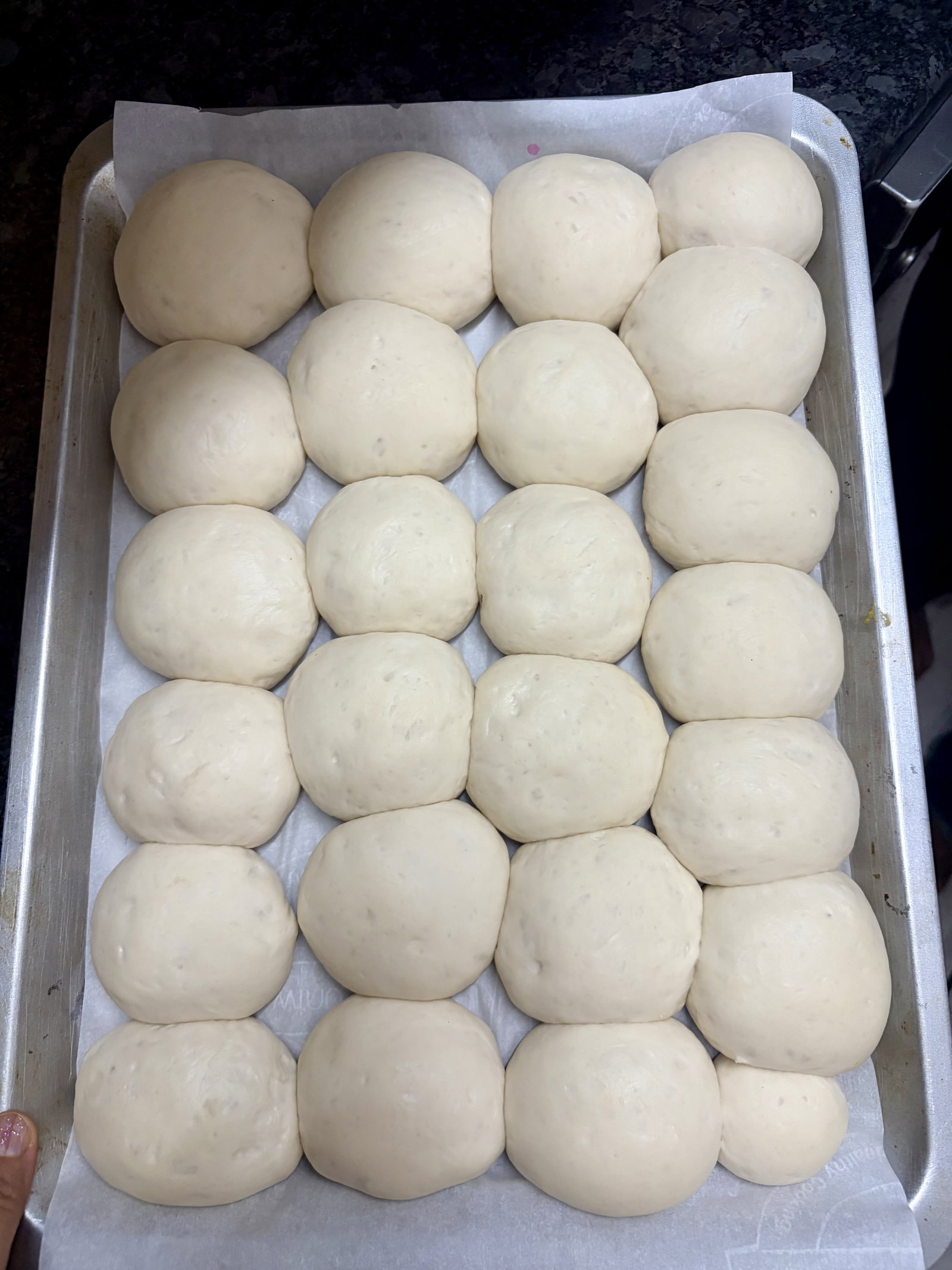 Step 5.1: Cover loosely with a damp cloth and let them rise for 45–60 minutes until doubled in size and tightly crowded together