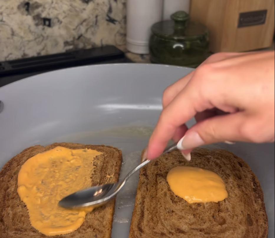 Step 2.1: Spread thousand island dressing on one side of each slice of rye bread