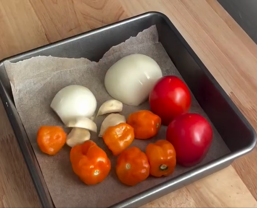 Step 2.1: Roast habaneros, tomatoes, onions, and garlic at 425°F for 15 minutes until they develop a hard char