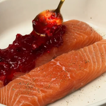 Step 2.1: Spread homemade cranberry sauce on top of the salmon fillets