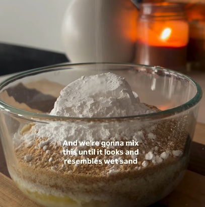 Step 1.1: Mix the graham cracker crumbs, butter, powdered sugar, and salt together until it resembles wet sand and holds when pressed
