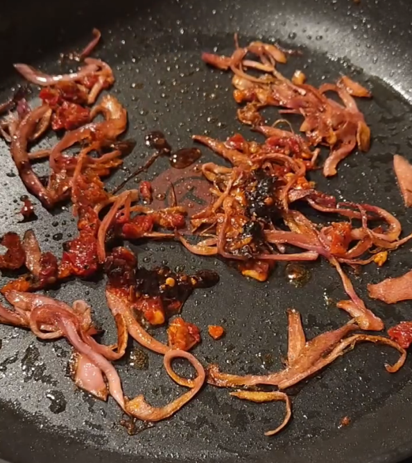 Step 1.1: Heat olive oil in a pan on medium-high heat, then add rinsed pickled onions and maple syrup