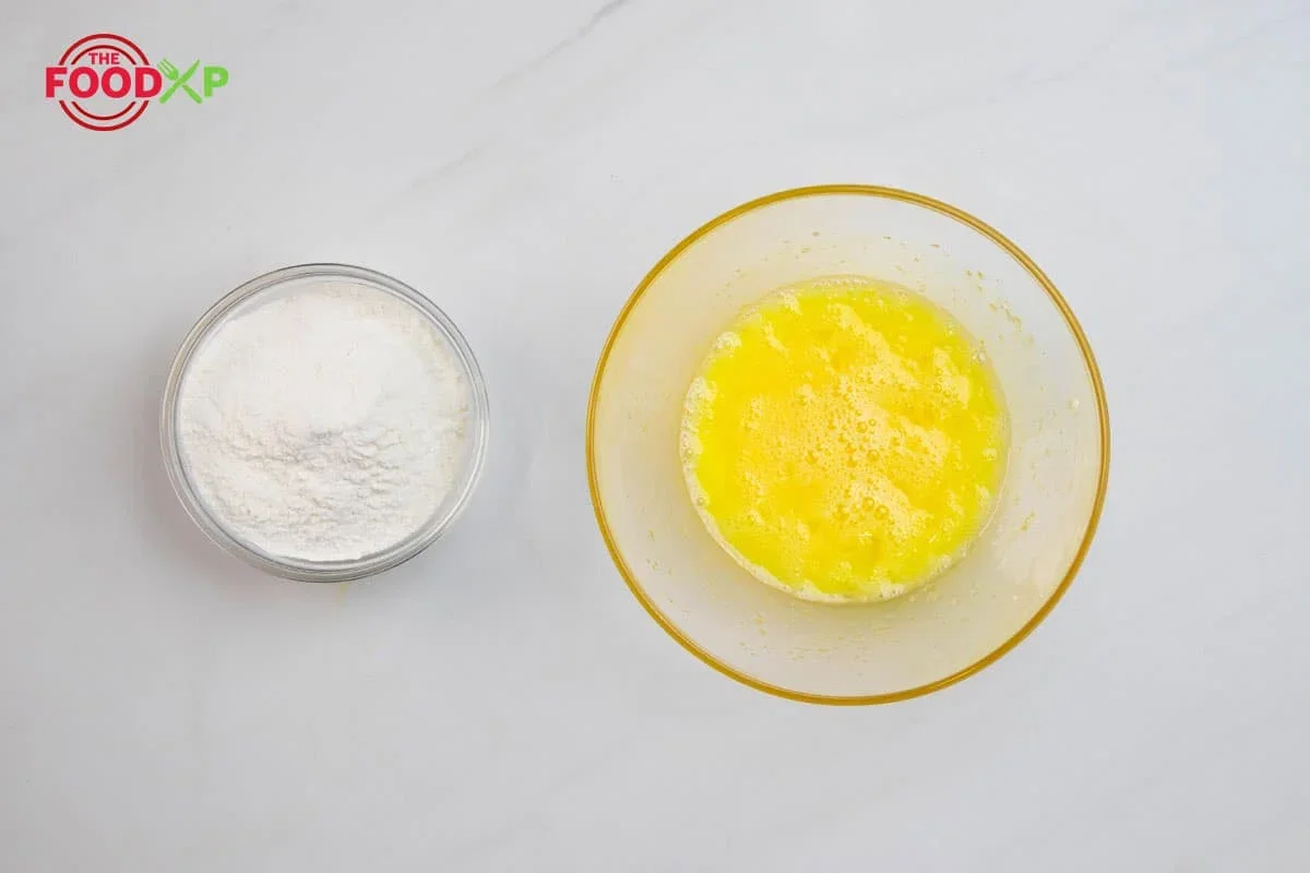 Step 1.1: Sift 2 cups (250 g) of all-purpose flour into the egg mixture