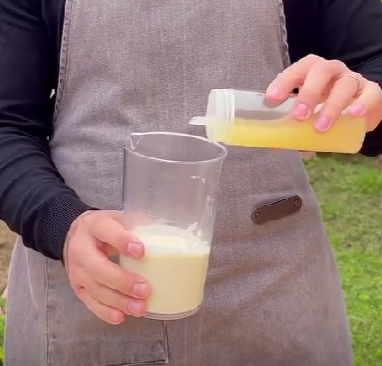 Step 2.1: Gradually add olive oil to the garlic while blending until the mixture becomes creamy