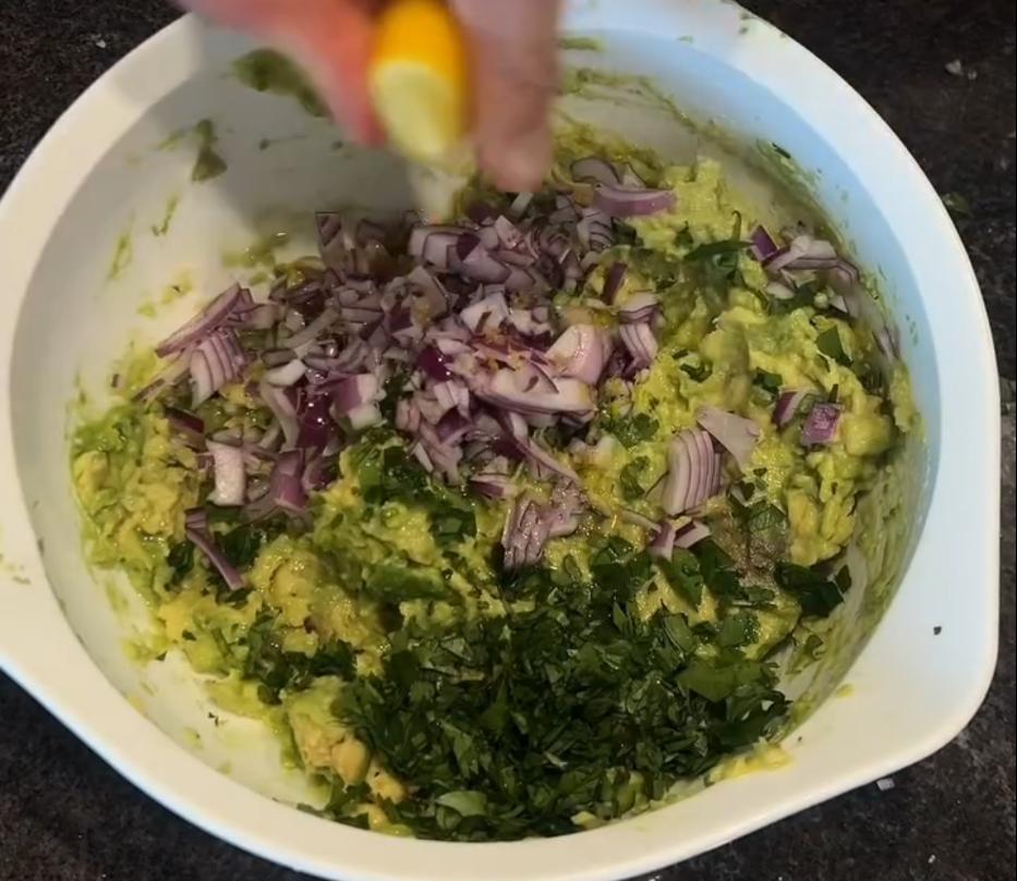 Step 2.1: Mash the avocados and mix with the diced red onion, coriander, lemon juice, salt, and pepper