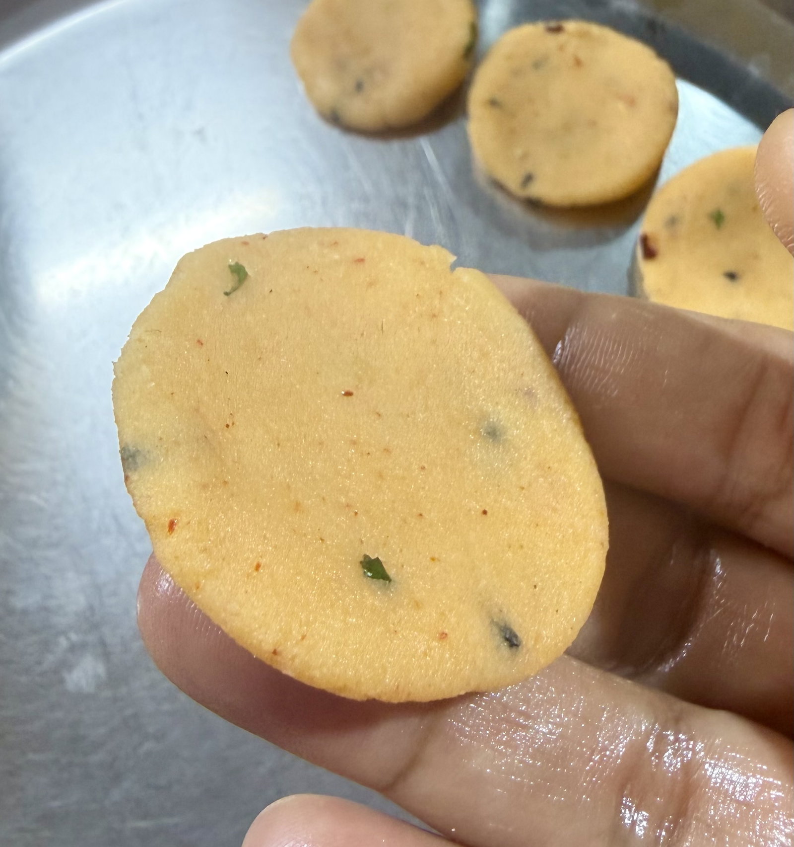 Step 3.1: Flatten each ball gently between your palms to form small discs (about 4–5 mm thick)