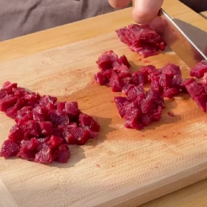 Step 1.1: Cut the beef and potatoes into small cubes