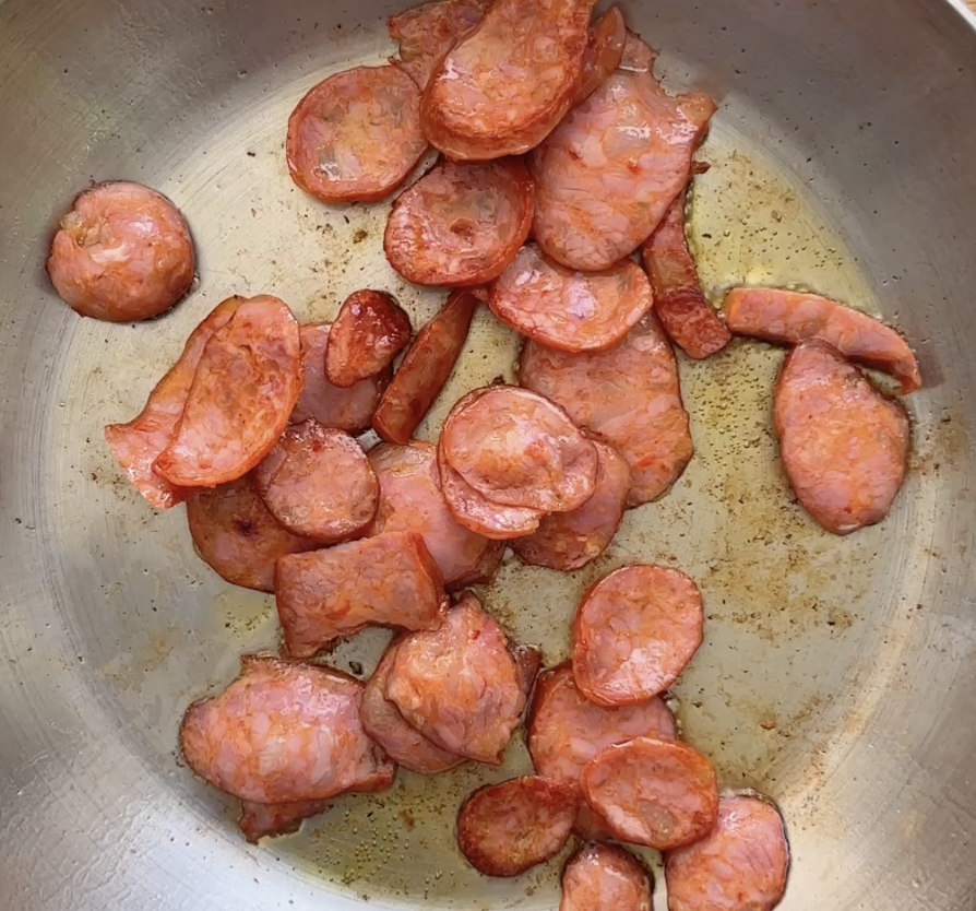 Step 1.1: Fry the thinly sliced chorizo in a drizzle of olive oil for 5 minutes, or until it starts rendering its fat and developing colour