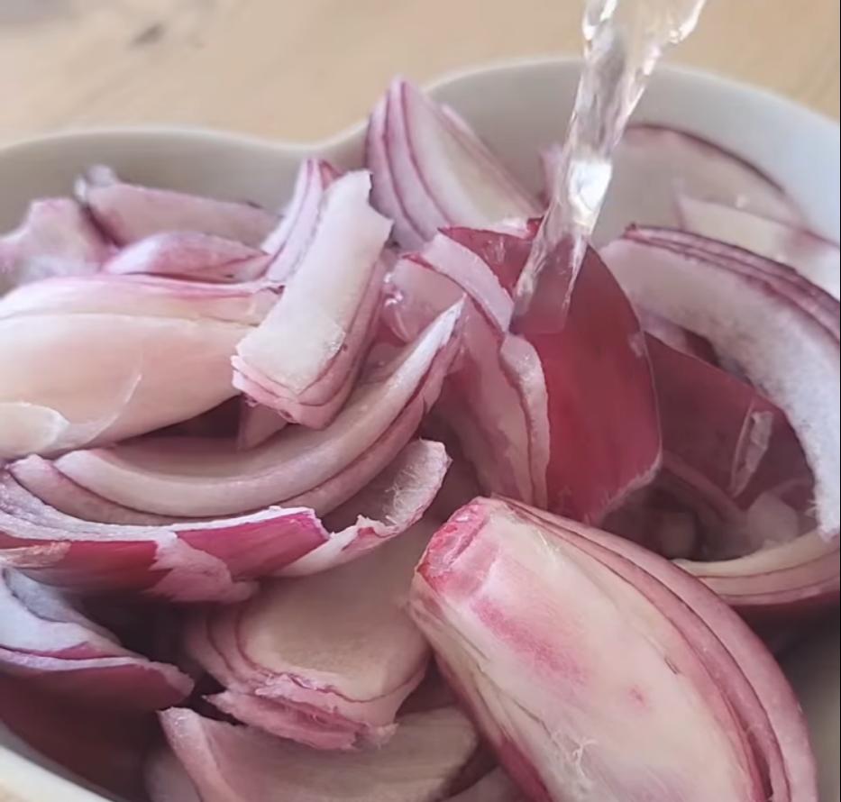 Step 1.1: Place onions in a bowl and cover with boiling water