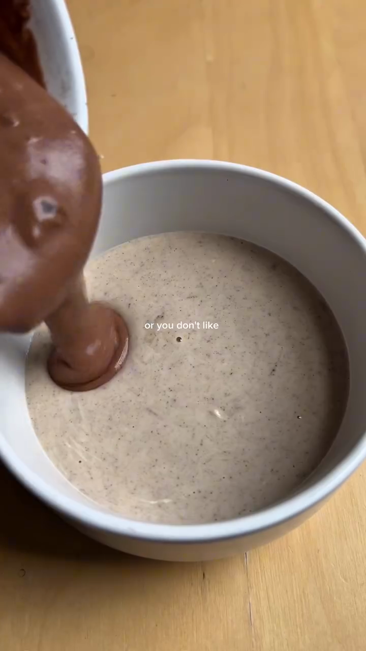 Step 1.1: In an oven-safe bowl or ramekin, pour the Oreo batter and chocolate batter into separate sides of the bowl to create a two-tone effect