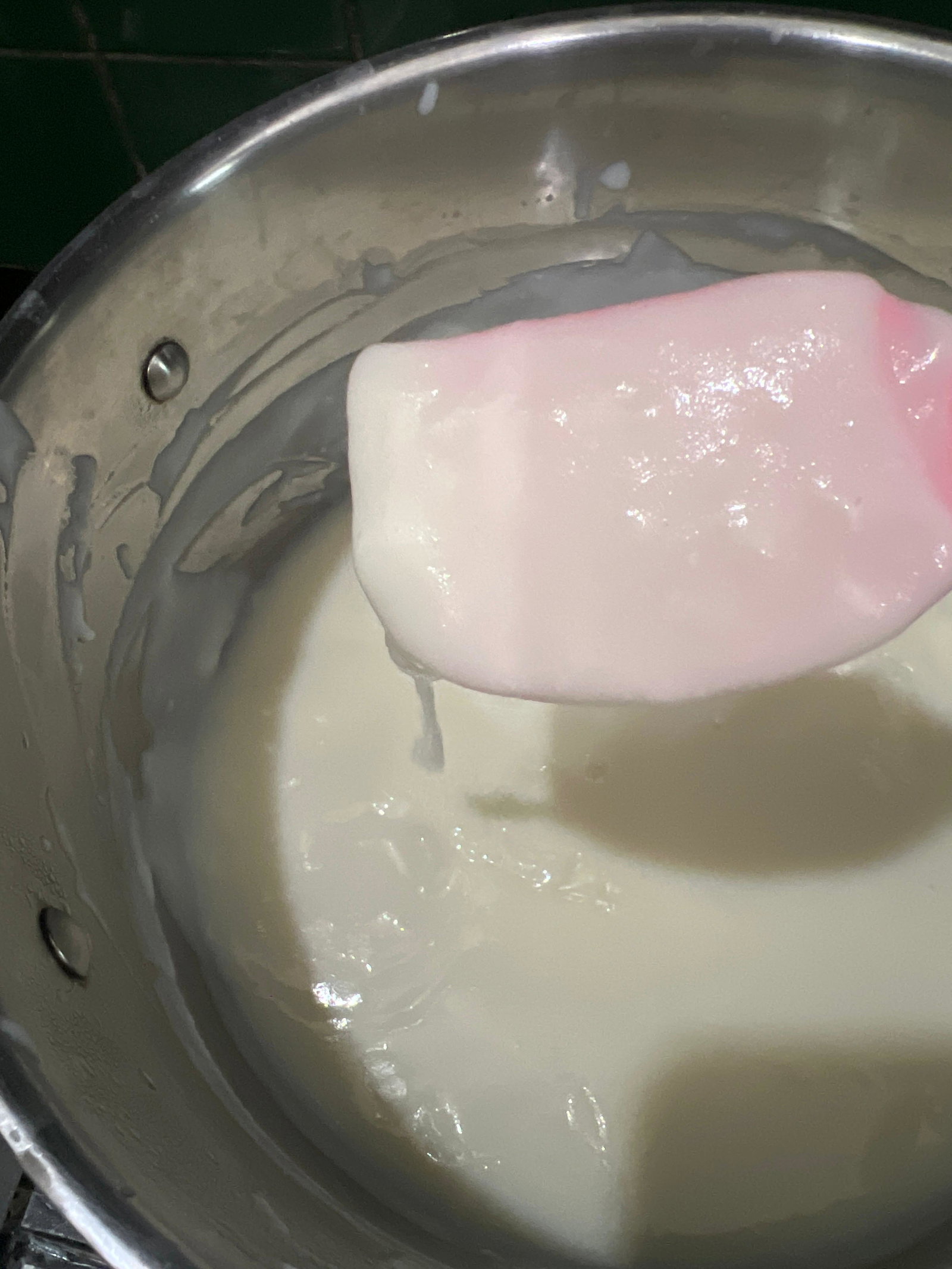 Step 1.2: Add sugar and continue cooking until the phirni coats the back of a ladle and a line drawn on it remains undisturbed