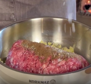 Step 2.1: Add the coarse minced beef, salt, black pepper, and all spice to the pan