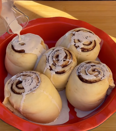 Step 4.1: Pour the cream mix over the rolls just before baking