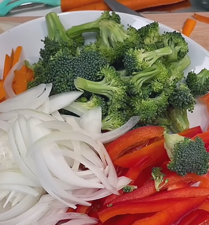 Step 1.1: Slice onion, bell peppers, and carrots