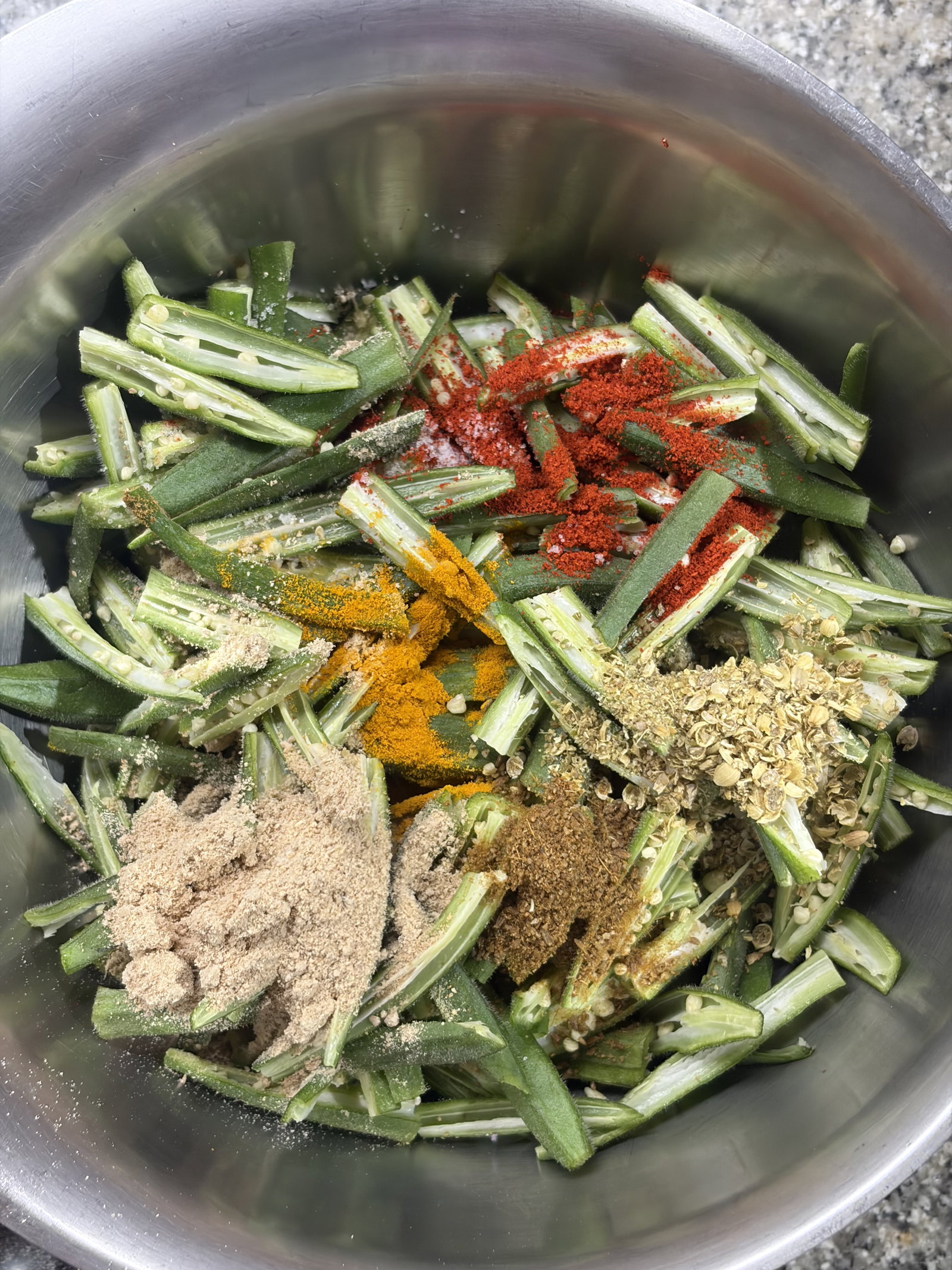 Step 1.1: Add the red chilli powder, coriander powder, cumin powder, turmeric, 1 tsp of the chaat masala, amchur powder, and salt