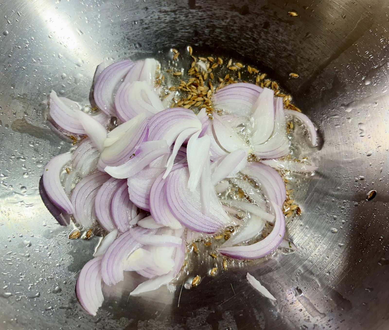 Step 2.1: Add the sliced onion and sauté until the edges turn golden brown