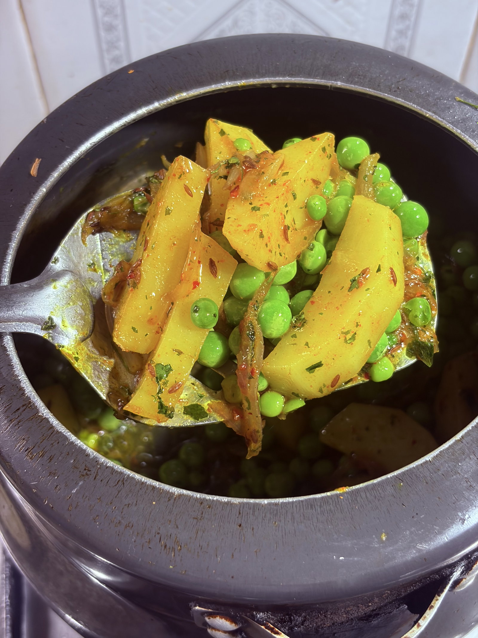 Step 1.1: Toss in the potatoes and peas